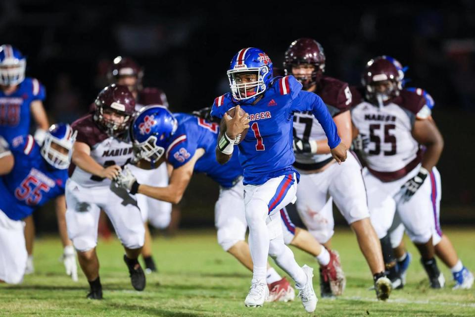 Mercer County quarterback Thaddeus Mays (1) has rushed for 16 touchdowns and passed for 12 this season.