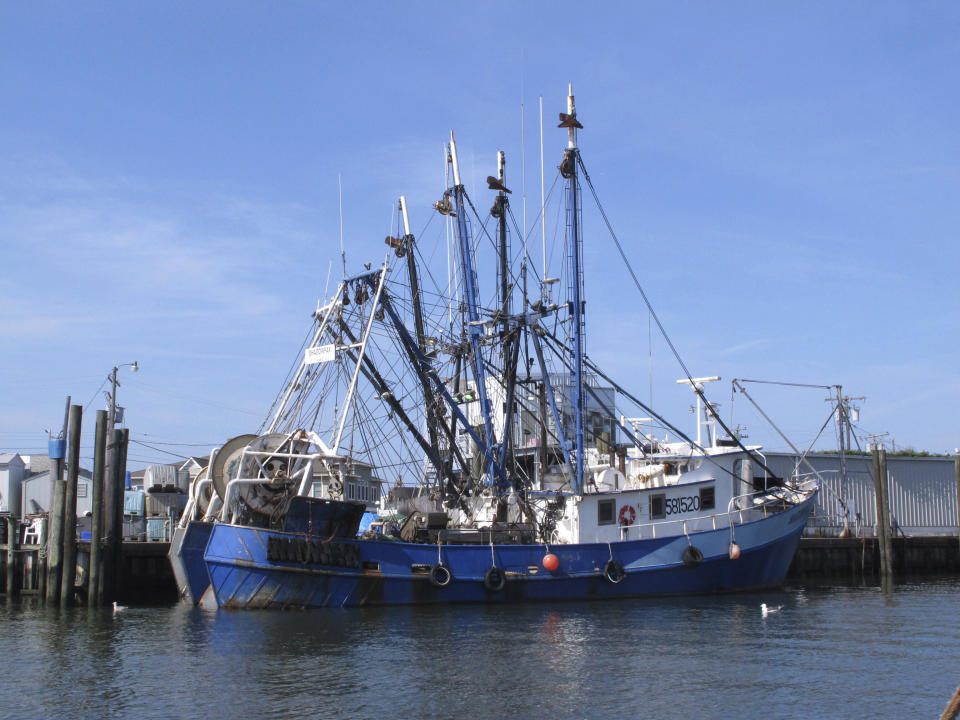 Fishing boats sit at the dock in Point Pleasant Beach, N.J. on Sept. 11, 2019. A report issued March 29, 2023 by two federal marine science agencies and the commercial fishing industry highlighted several potential negative aspects of offshore wind energy development on the fishing industry and called for additional research. (AP Photo/Wayne Parry)