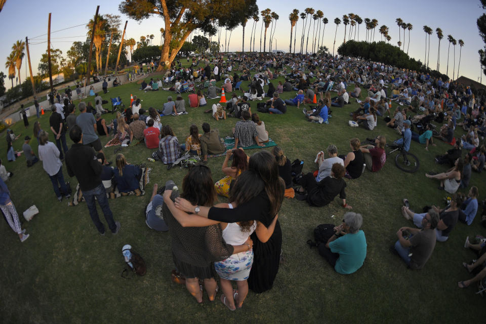 Several hundred people attend a vigil Friday, Sept. 6, 2019, in Santa Barbara, Calif., for the victims who died aboard the dive boat Conception. The Sept. 2 fire took the lives of 34 people on the ship off Santa Cruz Island off the Southern California coast near Santa Barbara. (AP Photo/Mark J. Terrill)