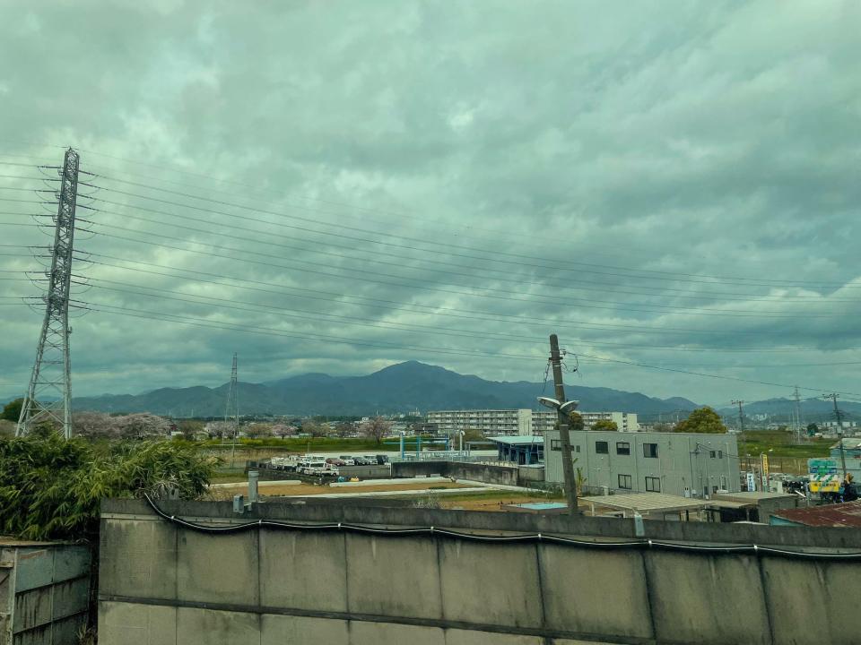 A view of a mountain from the bullet train.