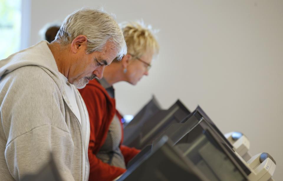 People casting ballots on electronic machines in Utah. Source: George Frey/Getty Images