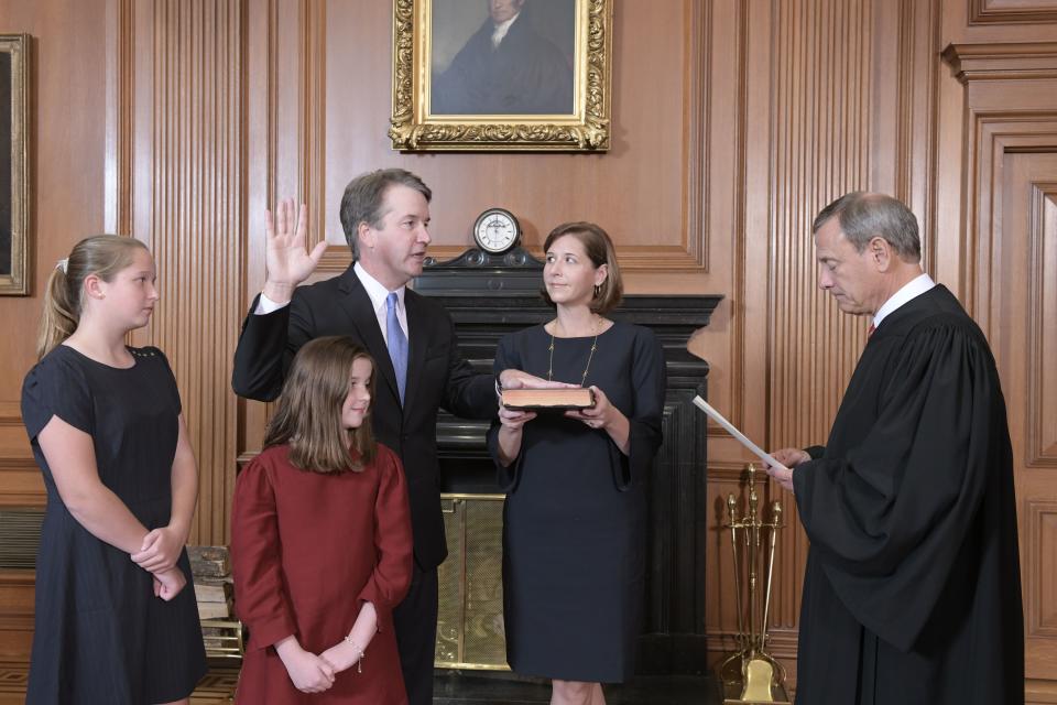 Chief Justice John Roberts administered the constitutional oath to Associate Justice Brett Kavanaugh in the Justices' Conference Room of the Supreme Court in October, with Kavanaugh's wife and daughters looking on.