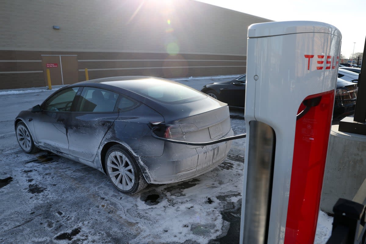 A Tesla charges in an ice-covered parking lot on January 17, 2024 in Chicago, Illinois. A breakthrough in battery techonology could vastly improve power longevity for electric vehicles (Getty Images)