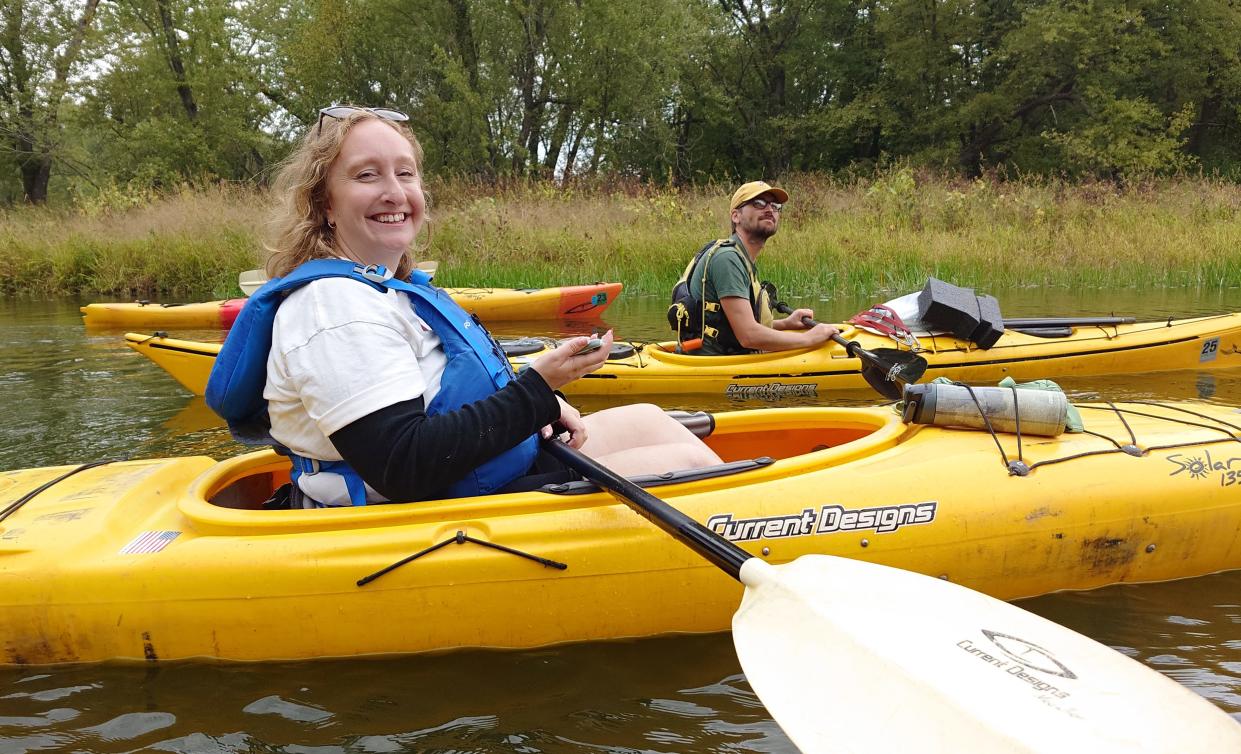 Milwaukee Journal Sentinel reporter Madeline Heim is shown at work on a tributary of the Mississippi River near Nelson, Wisconsin.