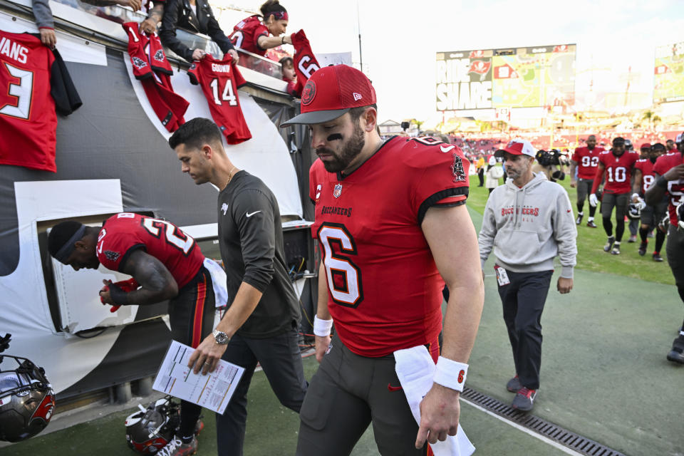 Tampa Bay Buccaneers quarterback Baker Mayfield (6) walks off the field after an NFL football game against the New Orleans Saints in Tampa, Fla., Sunday, Dec. 31, 2023. The Saints won 23-13. (AP Photo/Jason Behnken)