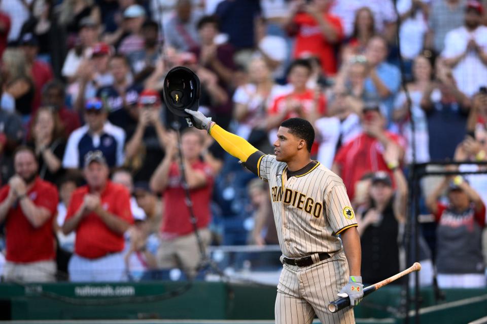 Juan Soto tips his cap to Washington Nationals fans during his first at-bat Friday night.