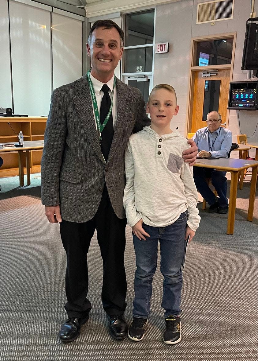 Fritz Schlueter, West Branch Intermediate School principal, with fourth-grader Liam Granger, the district's honored student for November.