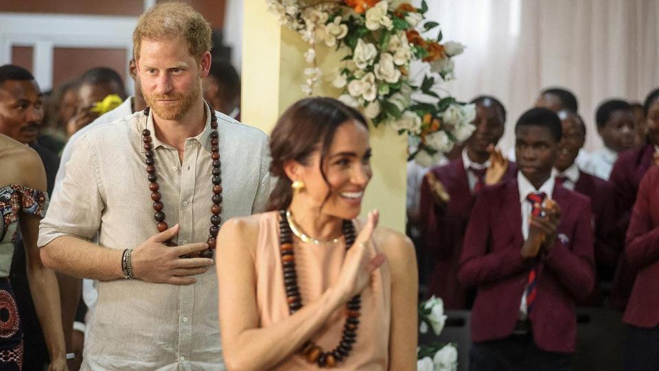 Prince Harry and Meghan are feted in a school in Nigeria