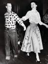 <p>Two years before her coronation, then-Princess Elizabeth grabbed her partner — her husband of four years, naturally — for a spin during a royal tour of Canada in 1951. The pair dressed the part (complete with a neckerchief for Philip!) as they enjoyed an old-fashioned square dance in Ottawa.</p>