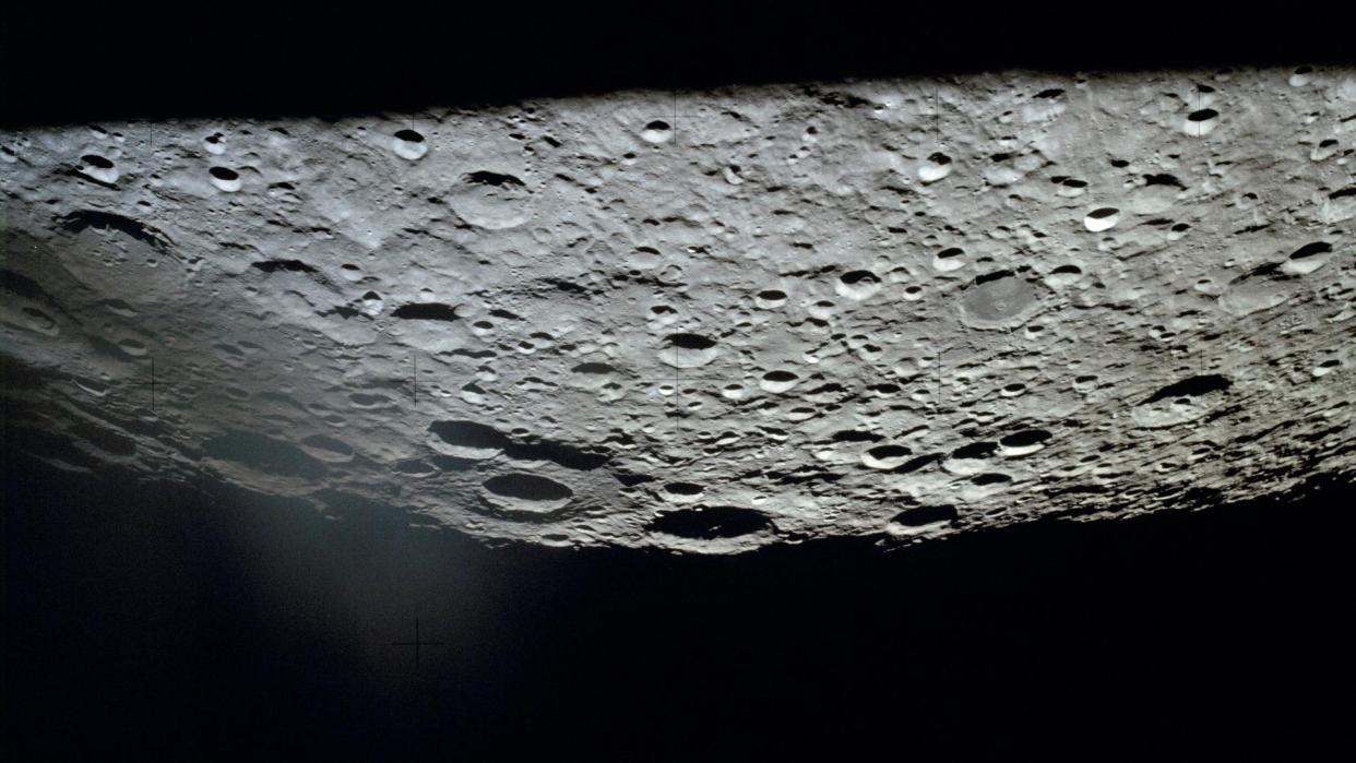  The farside of the moon, photographed by Apollo 13, hangs upside-down over the blackness of space 