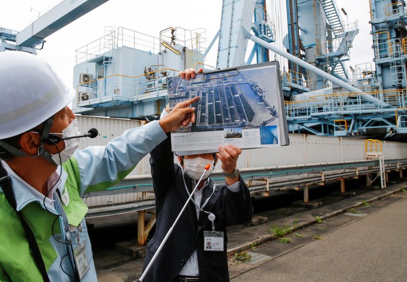 Employees of JERA give lectures to reporters at JERA's Hekinan thermal power station in Hekinan, central Japan
