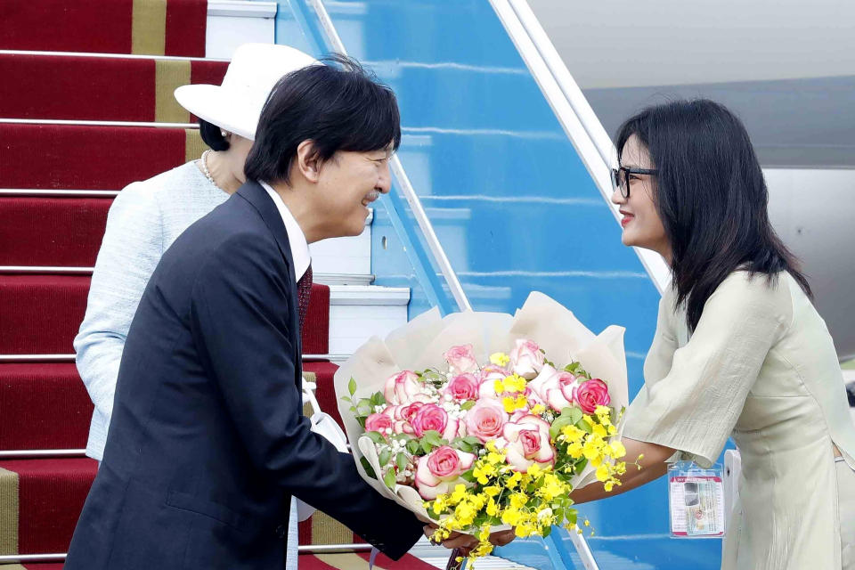 Japanese Crown Prince Akishino receives flowers from a Vietnamese official after landing in Hanoi, Vietnam Wednesday, Sept. 20, 2023. Akishino and Crown Princess Kiko are on a visit to Vietnam to mark the 50th anniversary of the diplomatic relation between the two countries. (An Van Dang/VNA via AP)