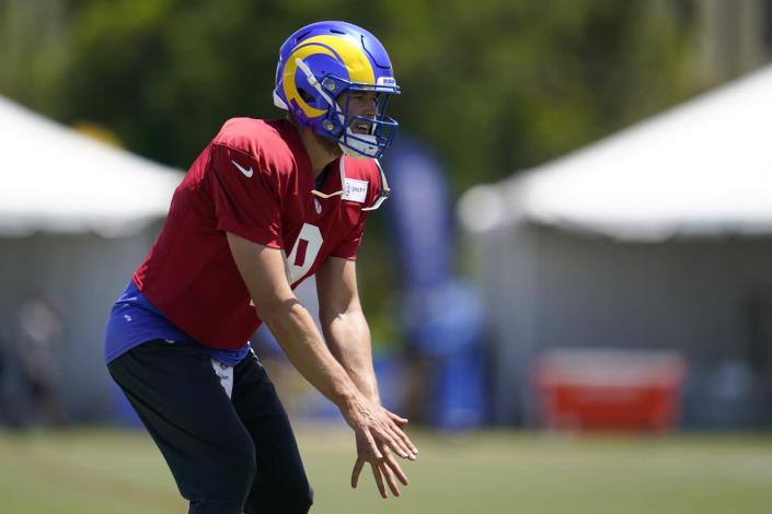 Rams quarterback Matthew Stafford readies to take a snap during practice.