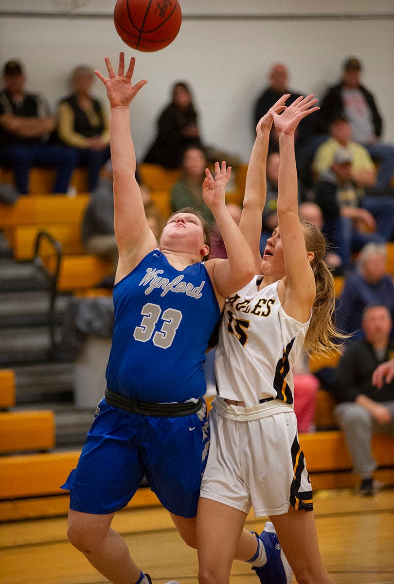 Wynford's Alexis Stevely puts up a shot around Colonel Crawford's Niyah Shipman.