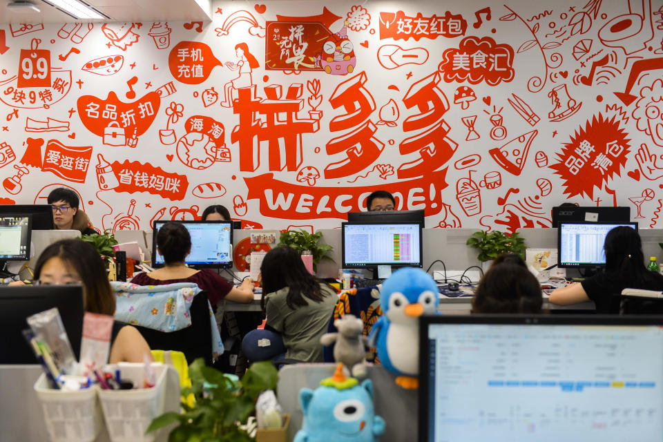 FILE - Workers sit on duty at the headquarters of Pinduoduo, an e-commerce platform, in Shanghai on July 25, 2018. Google has suspended the Chinese shopping app Pinduoduo on its app store after malware was discovered in versions of the app from other sources. Google said in a statement Tuesday, March 21, 2023, that it suspended the Pinduoduo app on the Google Play app store out of “security concerns” and that it was investigating the matter. (Chinatopix via AP, File)