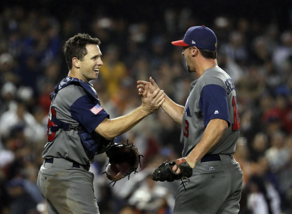 United States' Buster Posey and Luke Gregerson celebrate after the United States defeated Japan, 2-1, in a semifinal in the World Baseball Classic in Los Angeles, Tuesday, March 21, 2017. (AP Photo/Chris Carlson)