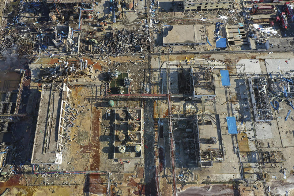 In this aerial photo released by China's Xinhua News Agency, damaged buildings are seen at the site of a factory explosion in a chemical industrial park in Xiangshui County of Yancheng in eastern China's Jiangsu province, Friday, March 22, 2019. The local government reports the death toll in an explosion at a chemical plant in eastern China has risen with dozens killed and more seriously injured. (Ji Chunpeng/Xinhua via AP)