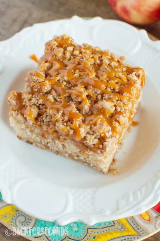<p>Back for Seconds</p><p>Caramel Apple Crumb Cake is a scrumptious fall dessert! Filled with cinnamon and apples, loaded with a buttery crumb topping and a salted caramel drizzle.</p><p><strong>Get the recipe: </strong><a href="https://backforseconds.com/caramel-apple-crumb-cake/" rel="nofollow noopener" target="_blank" data-ylk="slk:Caramel Apple Crumb Cake;elm:context_link;itc:0;sec:content-canvas" class="link "><strong>Caramel Apple Crumb Cake</strong></a></p>