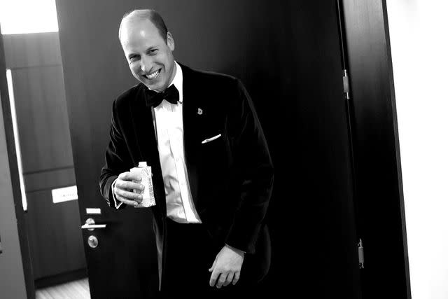 <p>Chris Jackson/Getty Images for Earthshot</p> Prince William has a laugh as he drinks some water backstage during the 2023 Earthshot Prize Awards Ceremony, on Nov 7