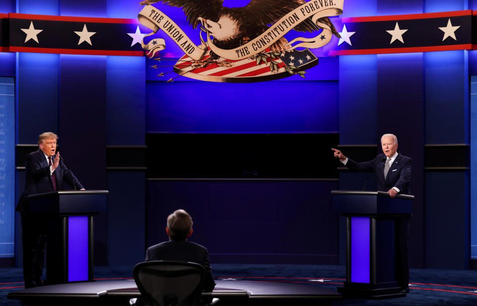 U.S. President Donald Trump and Democratic presidential nominee Joe Biden participate in their first 2020 presidential campaign debate held on the campus of the Cleveland Clinic at Case Western Reserve University in Cleveland, Ohio, U.S., September 29, 2020. REUTERS/Jonathan Ernst     TPX IMAGES OF THE DAY