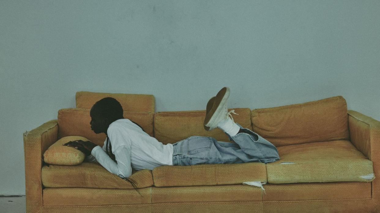 a person lying on a couch