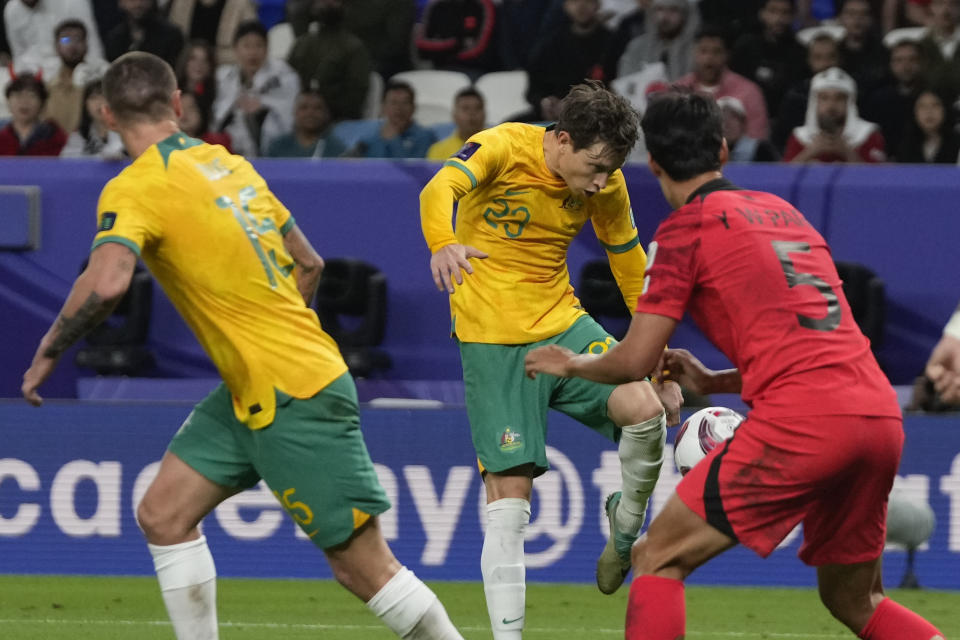 Australia's Graig Goodwin, center, kicks to score his team's first goal during the Asian Cup quarterfinal soccer match between Australia and South Korea at Al Janoub Stadium in Al Wakrah, Qatar, Friday, Feb. 2, 2024. (AP Photo/Thanassis Stavrakis)