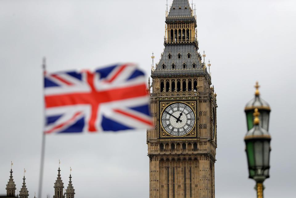 A British flag flies near the "Big Ben" clock tower of Parliament in London.