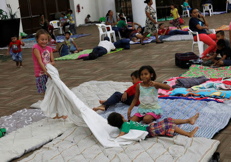 Children who were evacuated from their homes play in a big room at the Convention Center being used as a shelter while Hurricane Willa approaches the Pacific beach resort, Mexico October 23, 2018. REUTERS/Henry Romero