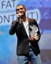 DUBAI, UNITED ARAB EMIRATES - DECEMBER 16: Actor Amr Waked with the Muhr Arab Feature Best Actor award on stage during the Closing Ceremony on day eight of the 9th Annual Dubai International Film Festival held at the Madinat Jumeriah Complex on December 16, 2012 in Dubai, United Arab Emirates. (Photo by Gareth Cattermole/Getty Images for DIFF)