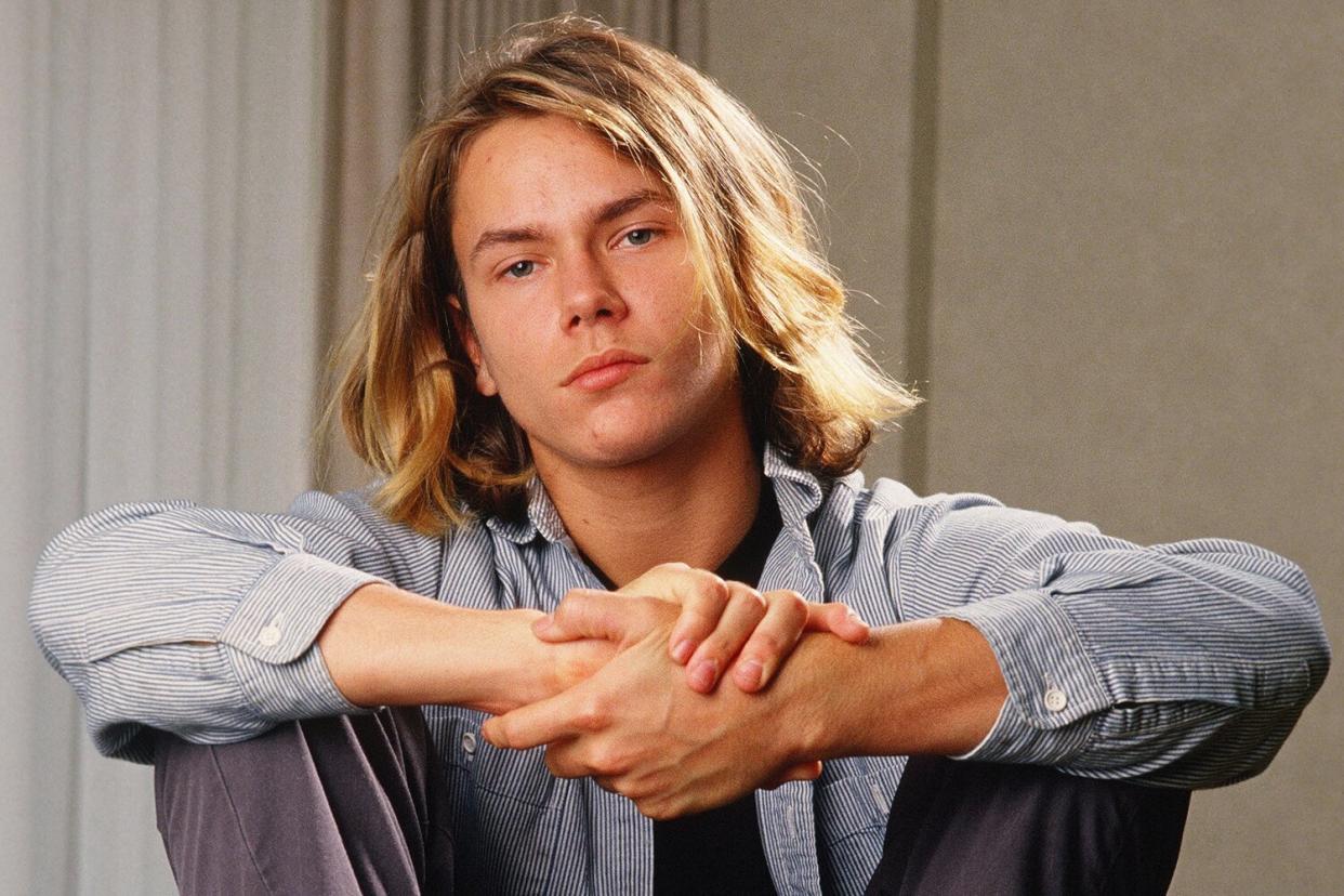 Actor River Phoenix, star of "Stand By Me," poses during a 1988 Los Angeles, California, photo portrait session. Phoenix, a rising young film star, tragically died in 1993 outside a Sunset Strip nightclub of a drug overdose.