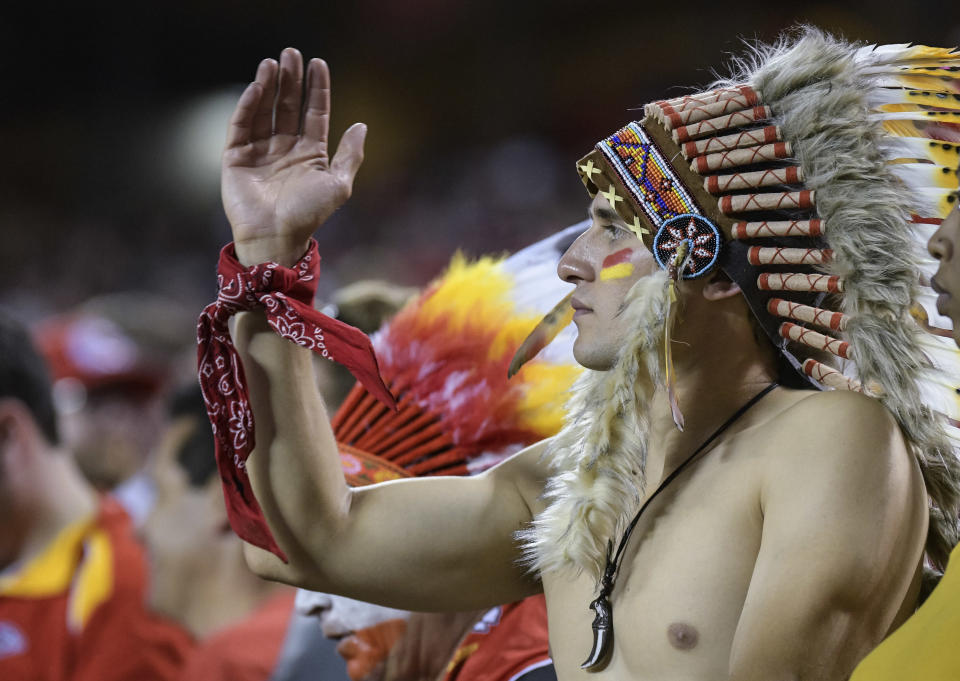 FILE - In this Oct. 2, 2017, file photo, a Kansas City Chiefs fan does the "tomahawk chop" during the second half of an NFL football game in Kansas City, Mo. While other sports teams using Native American nicknames and imagery have faced decades of protests and boycotts, the Chiefs have largely slid under the radar. Vincent Schilling, associate editor of Indian Country Today, said it's time for the Chiefs to face the music. "When I see something like a tomahawk chop, which is derived from television and film portrayals, I find it incredibly offensive because it is an absolutely horrible stereotype of what a native person is." (AP Photo/Reed Hoffmann, File)