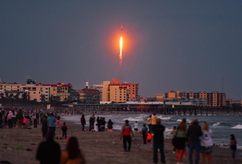 Launch of a SpaceX Falcon 9 rocket on the Starlink 6-35 mission at 5:35 p.m. Sunday, with Lori Wilson Park beach spectators in the foreground in Cocoa Beach.