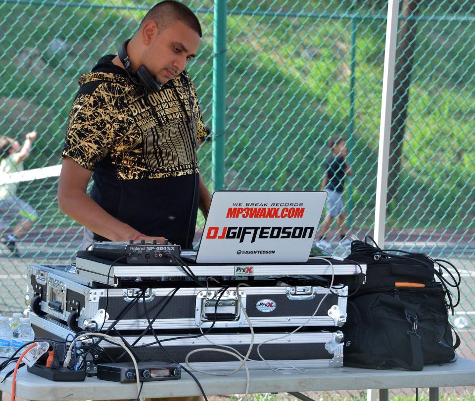 DJ GIFTED SoN, a Hagerstown native who resides in Washington, D.C., volunteers his services on opening day of the Ruthann V. Monroe Summer Basketball League on Sunday at Wheaton Park in downtown Hagerstown.