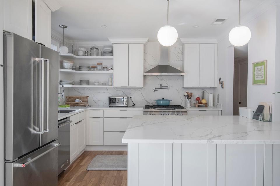 The kitchen includes stainless appliances.