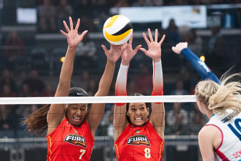 Feb 21, 2024; Columbus, OH, USA; Outside hitter Reagan Cooper, right, and Middle Blocker, Asjia O'Neal, left, go up for a block during the Columbus Fury home game against the Omaha Supernovas at Nationwide Arena.