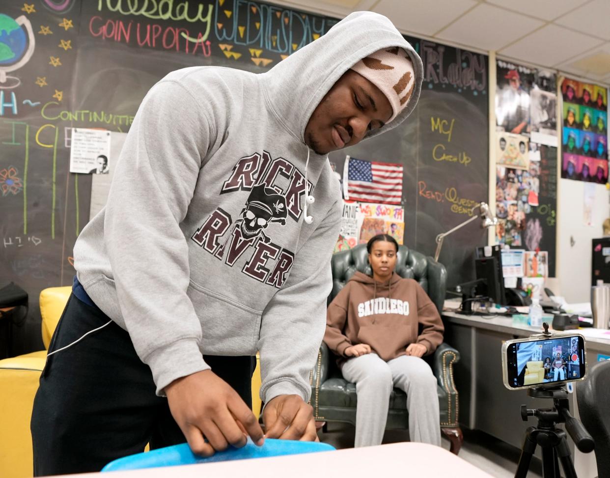 Ndiebnso Agborenow, 18, tapes his script to the back of a chair before recording a video on Feb. 22, 2024, with fellow students for Black History Month at Westerville North High School.