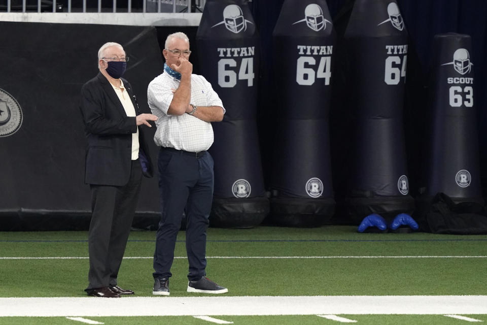 Dallas Cowboys owner Jerry Jones, left, and his son, chief operating officer Stephen Jones, watch an NFL football training camp in Frisco, Texas, Monday, Aug. 24, 2020. (AP Photo/LM Otero)