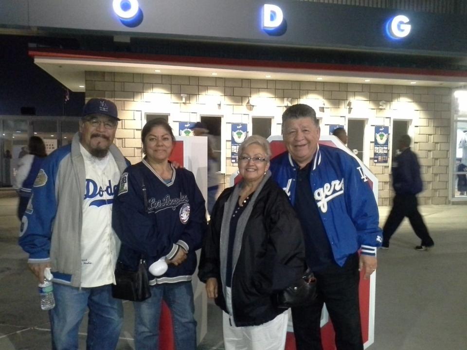 Paul and Helen Martinez with brother Pete Martinez and wife Louise. His wife said she and Paul would watch Dodgers games on TV in their bedroom "yelling, high fiving, just the two of us."