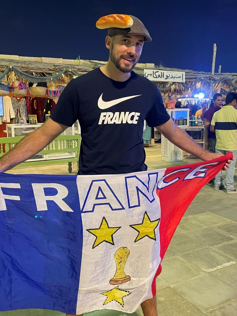 A France fan wearing a baguette hat