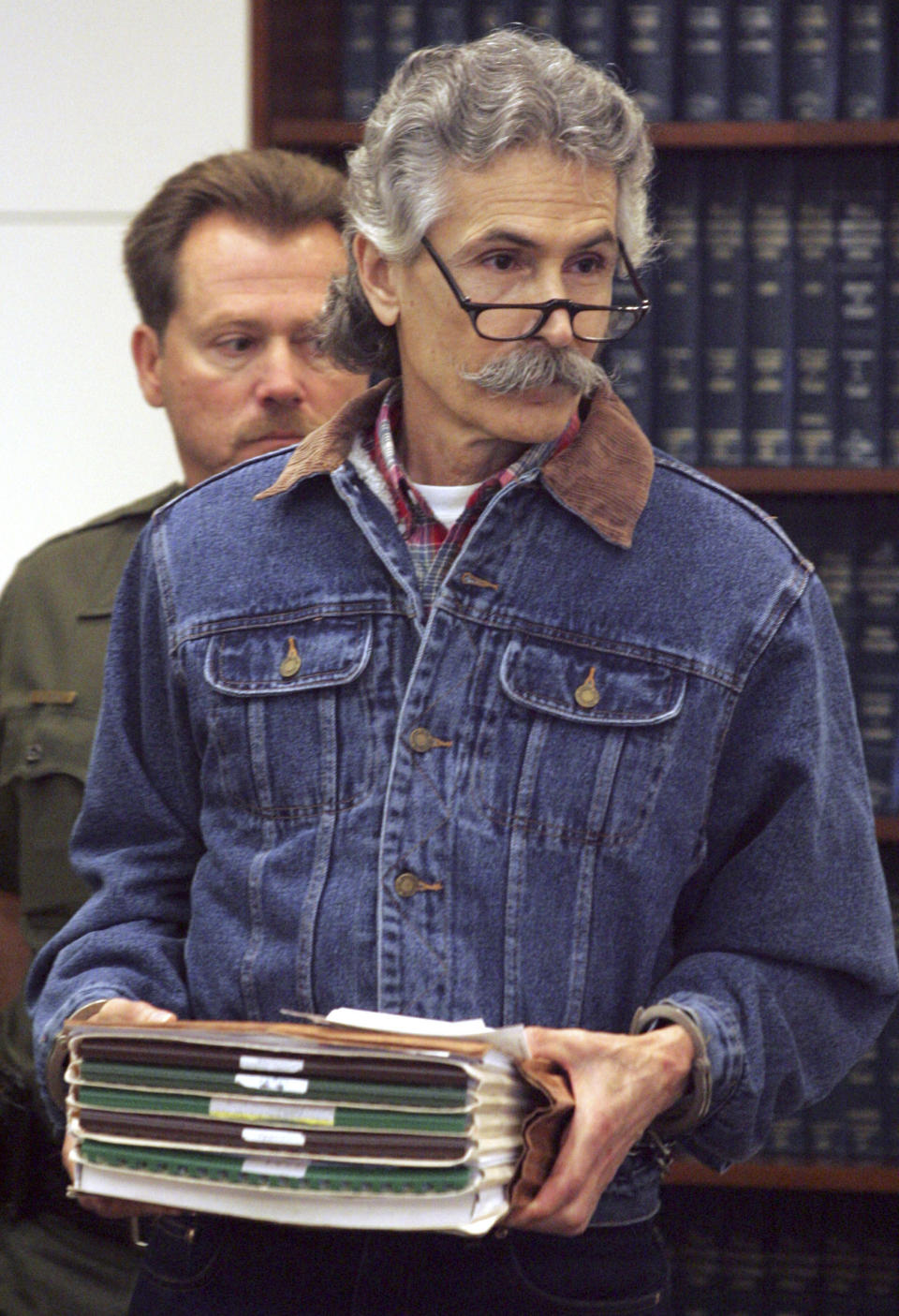 FILE - In this Sept, 19, 2005, file photo, Rodney James Alcala, a former death row inmate who was twice convicted of the 1979 killing of a 12-year-old Huntington Beach girl, is shown in Orange County Superior Court in Santa Ana, Calif. Alcala, a prolific serial torture-slayer dubbed "The Dating Game Killer" has died while awaiting execution in California. He died of natural causes at a hospital in San Joaquin Valley, Calif., prison officials said in a statement. (Ygnacio Nanetti/The Orange County Register via AP)