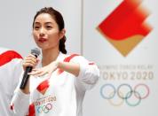 Tokyo 2020 Torch Relay Official Ambassador and actress Satomi Ishihara presents the Olympic torchbearers' uniform in Tokyo