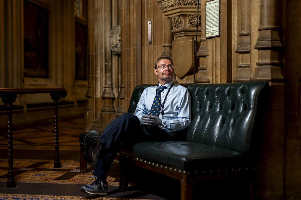 Conservative legislator Craig Mackinlay looks up during an interview in the Central Lobby of the Palace of Westminster, London, Wednesday May 22, 2024. Mackinlay returned to work six months after sepsis put him in a coma and forced the amputation of his hands and feet. (Jordan Pettitt/PA via AP)