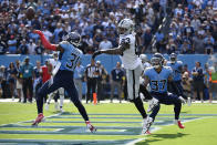 Tennessee Titans safety Kevin Byard (31) breaks up a pass intended for Las Vegas Raiders tight end Darren Waller (83) on a failed 2-point conversion late in the fourth quarter of an NFL football game Sunday, Sept. 25, 2022, in Nashville, Tenn. The Titans won 24-22. (AP Photo/Mark Zaleski)