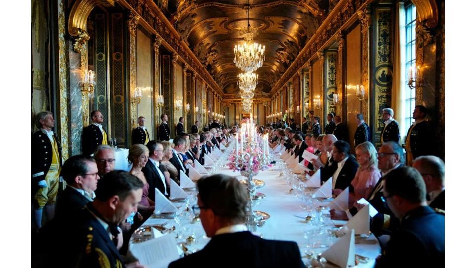 Guests attend a banquet at Stockholm Palace in Stockholm