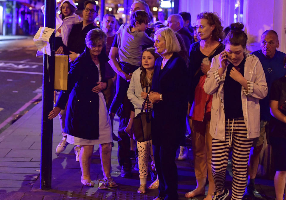 <p>People walking down Borough High Street as police are dealing with an incident on London Bridge in London, Saturday, June 3, 2017. Witnesses reported a vehicle hitting pedestrians and injured people on the ground. (Dominic Lipinski/PA via AP) </p>