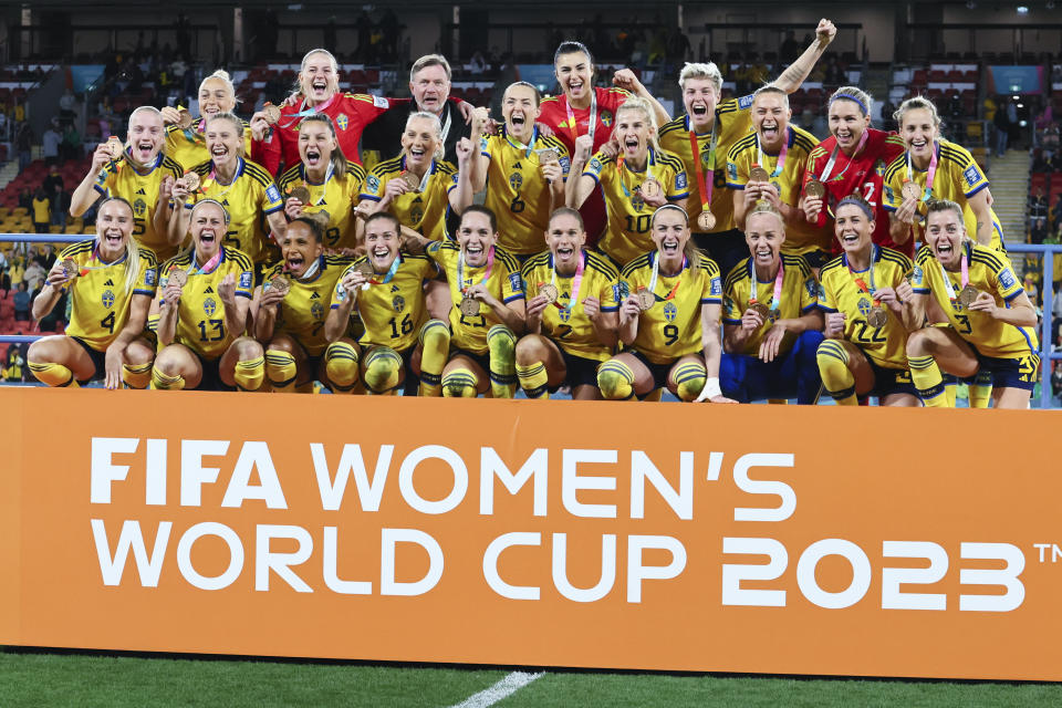 Sweden celebrate with their bronze medals after defeating Australia in the Women's World Cup third place playoff soccer match in Brisbane, Australia, Saturday, Aug. 19, 2023. (AP Photo/Tertius Pickard)