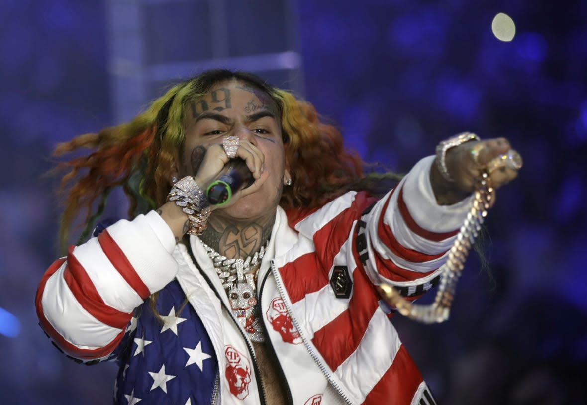 Rapper Daniel Hernandez, known as Tekashi 6ix9ine, performs during the Philipp Plein Women’s 2019 Spring-Summer Collection, unveiled during Fashion Week in Milan, Italy, Sept. 21, 2018. (AP Photo/Luca Bruno, File)