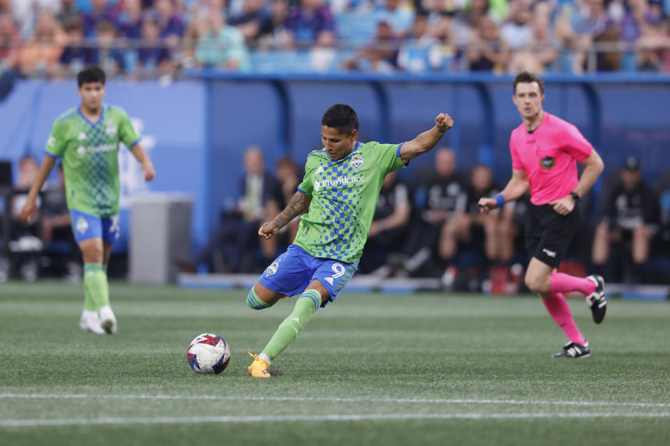 Seattle Sounders forward Raúl Ruidíaz (9) scores a goal during an MLS soccer match against the Charlotte FC, Saturday, June 10, 2023, in Charlotte, N.C. (AP Photo/Brian Westerholt)