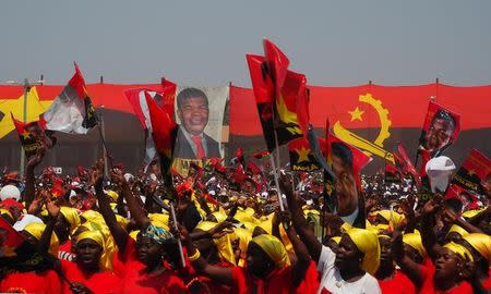 Supporters cheer as Joao Lourenco, presidential candidate for the ruling MPLA party, speaks at an election rally in Malanje, Angola, August 17, 2017. Picture taken August 17, 2017. REUTERS/Stephen Eisenhammer