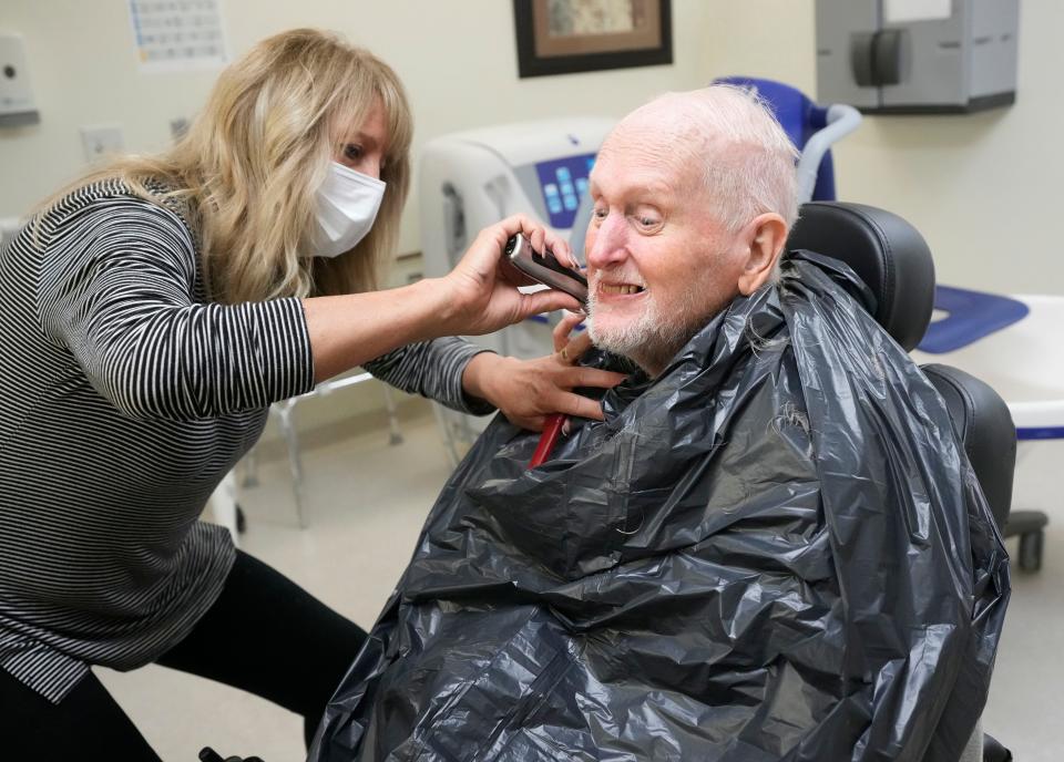 Veteran Tom Minich has his beard trimmed in May by stylist Tracy Swantz at the Union Grove veterans home.